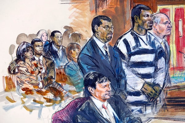 Artist's rendering shows Atlanta Falcons quarterback Michael Vick, wearing a black-and-white prison suit, along with his attorney's Billy Martin (left) and Lawrence Woodward (right) as he is sentenced in Federal Court  in Richmond, Va., Monday, Dec. 10, 2007.