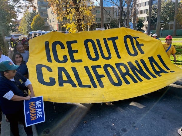 Immigration advocates hold a rally in Sacramento, Calif. on Monday, Dec. 2, 2024, to protest President-Elect Donald Trump's plans to conduct mass deportation of immigrants without legal status. (AP Photo/Haven Daley)