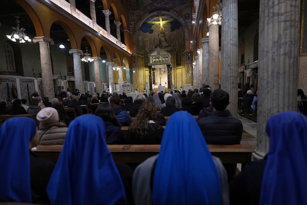 Pope's Vicar for Rome, Cardinal Baldassare Reina celebrates mass for the health of Pope Francis at the Church of the Argentinas, Santa Maria Addolorata in Rome, Italy Tuesday, Feb. 25, 2025. (AP Photo/Kirsty Wigglesworth)