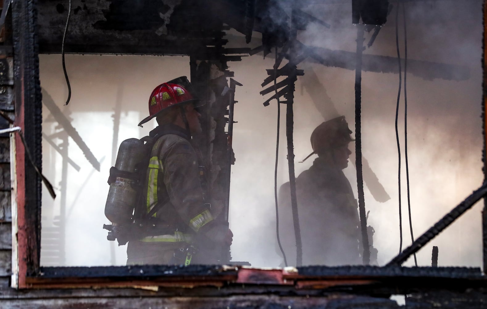 Amid arctic temperatures Wednesday morning, Jan. 17, 2024 a fire destroyed an abandoned house in northwest Atlanta, according to officials. Crews were dispatched around 8 a.m. to the vacant one-story home in the 600 block of Jett Street near Sunset Avenue, according to Atlanta fire Capt. Raymondo Hampton. Firefighters took a defensive attack on the fully involved residence until they could get to a point where they could conduct a search inside. No one was found during the search. “We were able to get a good stop on it pretty quick,” Hampton told The Atlanta Journal-Constitution. While the cause and origin of the fire is under investigation, Hampton said he suspects it was just people trying to stay warm. “It’s cold temperatures outside right now, we’re at about 14 degrees,” he said. The low temps were an obstacle for firefighters, who Hampton said typically bring extra equipment and clothes during similar operations as a precaution. He noted it was the second time fire crews responded to the home in recent months. No injuries were reported Wednesday. (John Spink / John.Spink@ajc.com)