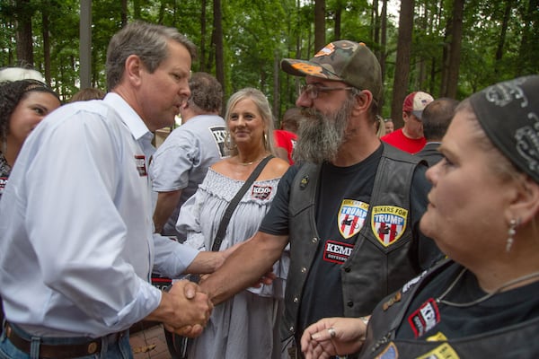 Secretary of State Brian Kemp shakes hands with a potential voter at a rally at the Roswell City Hall on  Sunday, July 22, 2018. (Photo: STEVE SCHAEFER / SPECIAL TO THE AJC)