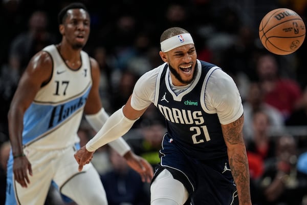 Dallas Mavericks center Daniel Gafford (21) loses the ball against Atlanta Hawks forward Onyeka Okongwu (17) during the first half of an NBA basketball game, Monday, Nov. 25, 2024, in Atlanta. (AP Photo/Mike Stewart)