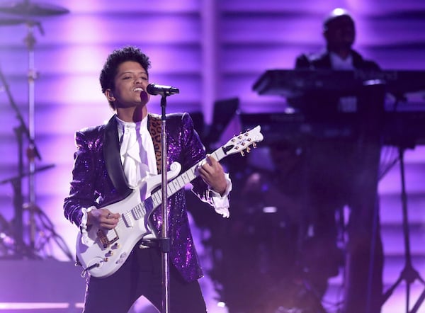 Bruno Mars performs a tribute to Prince at the 59th annual Grammy Awards on Feb. 12, 2017, in Los Angeles. MATT SAYLES/INVISION/AP