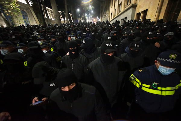 The police block the way to demonstrators during a rally outside the parliament's building to protest the government's decision to suspend negotiations on joining the European Union for four years in Tbilisi, Georgia, on Saturday, Nov. 30, 2024. (AP Photo/Zurab Tsertsvadze)