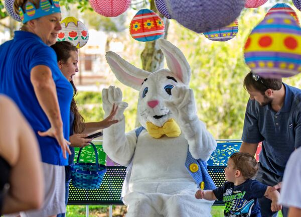 The Easter Bunny, aka Kristen Lehman, waves to children as they line up to have their picture taken with her, during the Easter Egg Hunt Saturday March 25, 2016, at the Jupiter Community Center. (Bill Ingram / The Palm Beach Post)