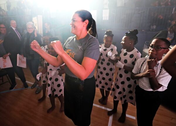 Atlanta Public Schools Superintendent Meria Carstarphen dances with Harper-Archer Elementary School dancers after she delivered her final State of the District address at the newly renovated Harper-Archer Elementary School.   Bob Andres / robert.andres@ajc.com