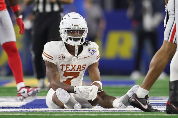 Texas wide receiver Isaiah Bond (7) reacts after an incomplete pass during the first half of the Cotton Bowl College Football Playoff semifinal game against Ohio State, Friday, Jan. 10, 2025, in Arlington, Texas. (AP Photo/Gareth Patterson)