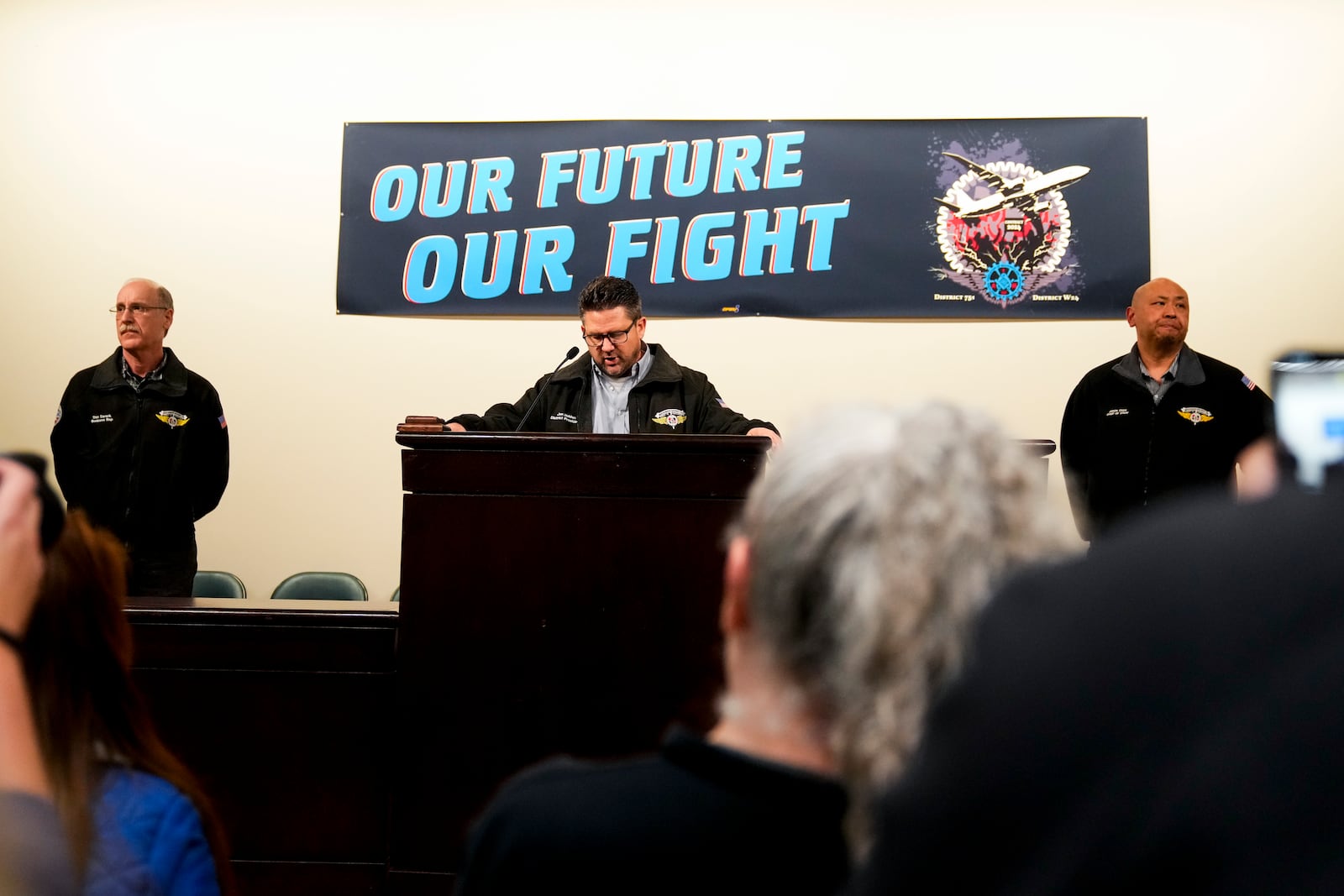 IAM District 751 president Jon Holden speaks to union members while announcing that they voted to accept a new contract offer from Boeing, Monday, Nov. 4, 2024, at their union Hall in Seattle. (AP Photo/Lindsey Wasson)