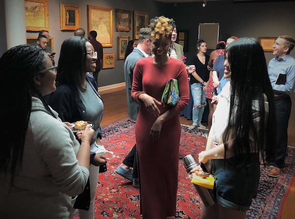 Students talk with artist and Georgia State University master’s degree student Shanequa Gay, (center) whose work "La Pieta," is the first painting in Oglethorpe's art museum by an African-American female artist.