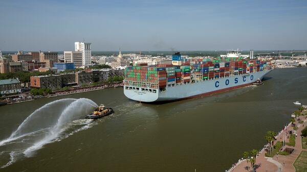 A container ship sails up river past Savannah's historic district in 2017.(AP Photo/Georgia Ports Authority, Stephen Morton)