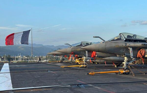 A French Navy personnel walks on a flight deck, abroad aircraft carrier, Charles de Gaulle at Subic Bay, a former U.S. Naval base, northwest of Manila, Philippines, Sunday, Feb. 23, 2025. (AP Photo/Joeal Calupitan)