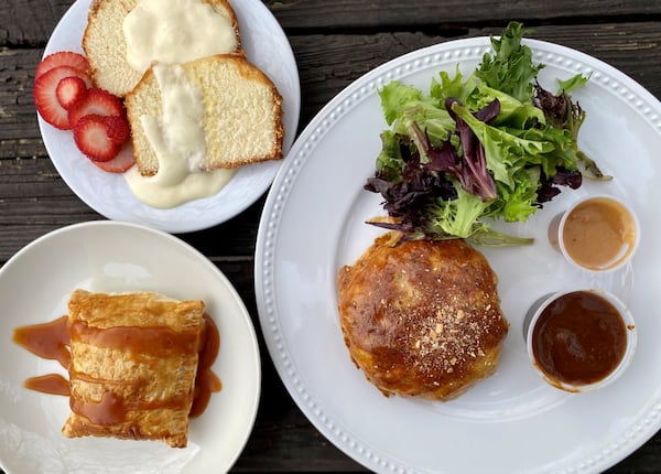 Fire Hen serves sweet and savory pastries as well as chicken. Shown here are the strawberry and cream pound cake, caramelized apple tart, and a savory hand pie stuffed with lamb and dried plum and served with a cinnamon plum dipping sauce and salad greens. Wendell Brock for The Atlanta Journal-Constitution