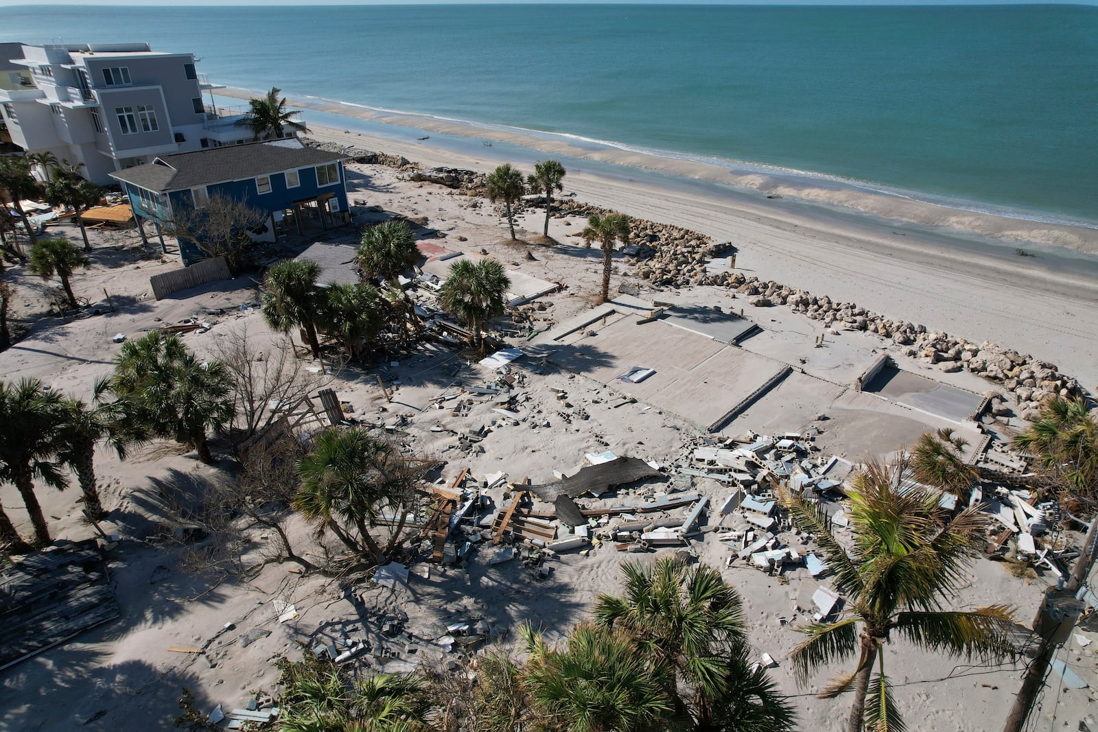 Bare foundations and debris are seen after buildings were swept away and destroyed in Hurricane Milton, on Manasota Key, in Englewood, Fla., Sunday, Oct. 13, 2024. (AP Photo/Rebecca Blackwell)