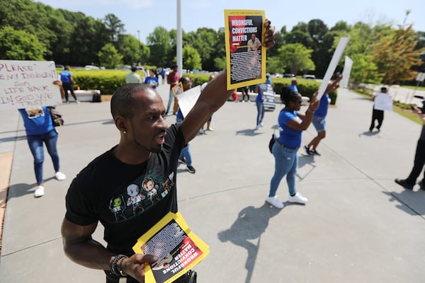 Family and friends gather outside of the Gwinnett Justice and Administration Center in support of Danyel Smith, who in 2003 was convicted for shaking his baby to death. A request for a new trial is pending before de Georgia Supreme Court. Thursday, May 5, 2022. Miguel Martinez /miguel.martinezjimenez@ajc.com