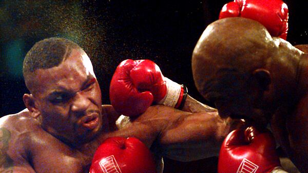 Mike Tyson and Evander Holyfield battle during their WBA Heavyweight Championship bout at the MGM Grand Garden in Las Vegas, Nev., Saturday, Nov. 9, 1996.