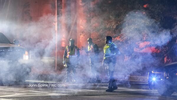 Atlanta police and fire officials responded to a fiery crash Wednesday. JOHN SPINK / JSPINK@AJC.COM