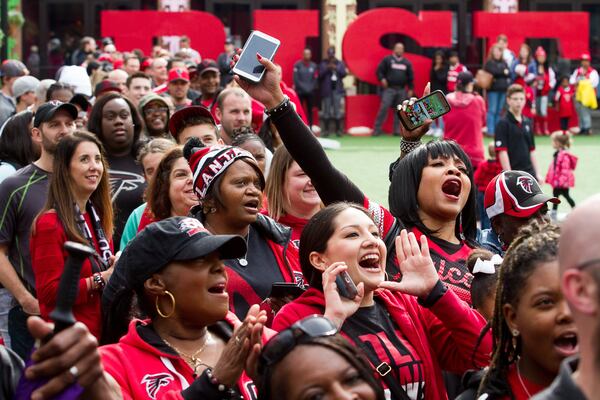 Crowds cheer for the Atlanta Falcons at this Jan. 21 Atlantic Station rally. The Falcons will meet the New England Patriots in Super Bowl LI on Feb. 5. STEVE SCHAEFER / SPECIAL TO THE AJC