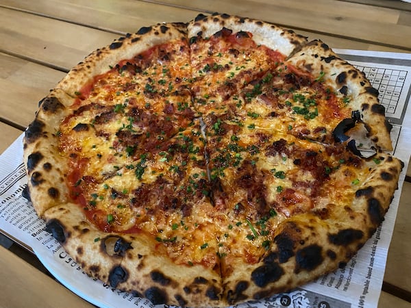 The Bacon Gouda pizza from Belli Pizzeria is a flavor bomb. (Ligaya Figueras / ligaya.figueras@ajc.com)