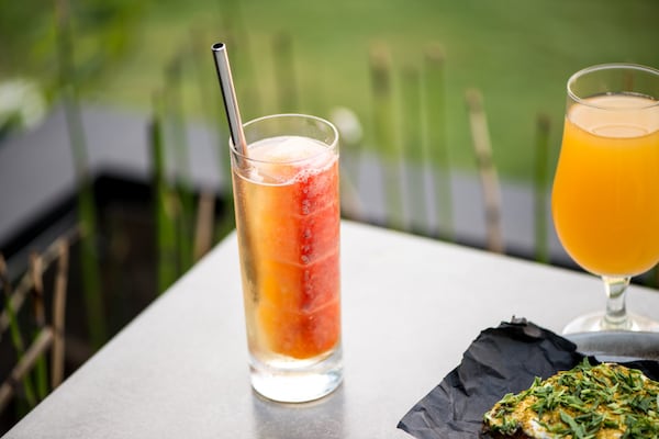 Endless Layers of Summer cocktail with aperitif, elderflower, alpine spirits, lemon verbena, basil seeds, and a tri melon mezcal cube. Photo credit- Mia Yakel.