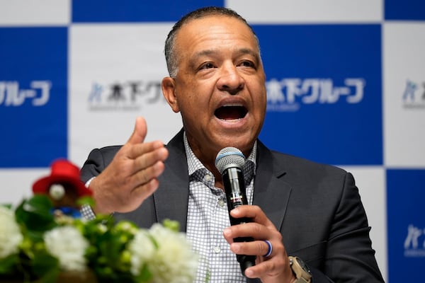 Los Angeles Dodgers manager Dave Roberts attends a press conference on the commercials he appears Wednesday, Dec. 4, 2024, in Tokyo. (AP Photo/Eugene Hoshiko)