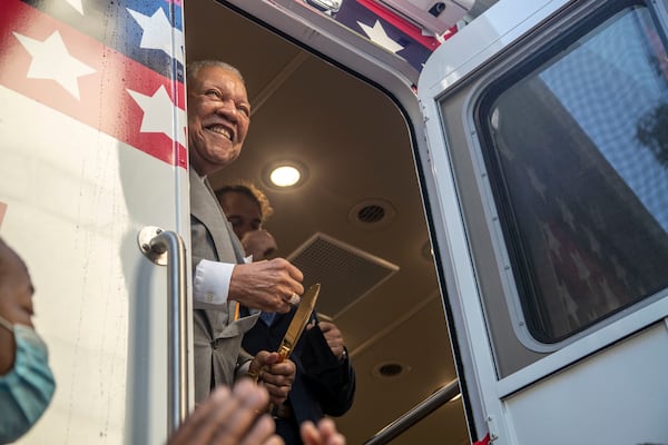 10/1/2020 - Atlanta, Georgia - Fulton Commission Chairman Robb Pitts reacts after cutting a ceremonial ribbon for a new Fulton County mobile voting bus in downtown Atlanta, Thursday, October 1, 2020.  (Alyssa Pointer / Alyssa.Pointer@ajc.com)