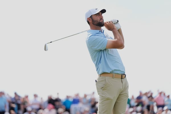 Scottie Scheffler watches his tee shot on the third hole during the second round of The Players Championship golf tournament Friday, March 14, 2025, in Ponte Vedra Beach, Fla. (AP Photo/Julia Demaree Nikhinson)