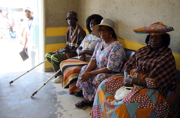 Namibians queue to cast their votes in a presidential election in Windhoek, Namibia Wednesday, Nov. 27, 2024. (AP Photo/Dirk Heinrich)