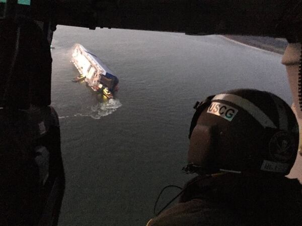 In this aerial photo provided by the U.S. Coast Guard, the M/V  Golden Ray cargo ship is shown capsized near St. Simons Island, Georgia, on Sunday, September 8, 2019.