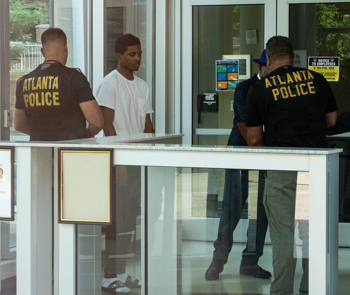 An Atlanta Police officer is about to handcuff Julian Conley