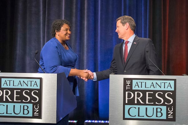 10/23/2018 -- Atlanta, Georgia -- Georgia Gubernatorial Democratic candidate Stacey Abrams and Republican candidate Brian Kemp greet each other before a live taping of the 2018 Gubernatorial debate for the Atlanta Press Club at the Georgia Public Broadcasting studio in Atlanta, Tuesday, October 23, 2018.  (ALYSSA POINTER/ALYSSA.POINTER@AJC.COM)