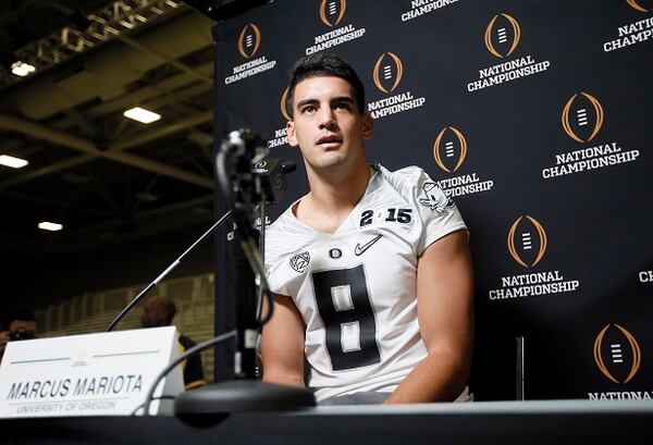 Oregon quarterback Marcus Mariota responds to a question during media day for the NCAA college football playoff championship, Saturday, Jan. 10, 2015, in Dallas. Oregon is scheduled to play Ohio State on Monday. (AP Photo/Tony Gutierrez) Oregon's Marcus Mariota meets the media Saturday. (Tony Gutierrez/AP photo)