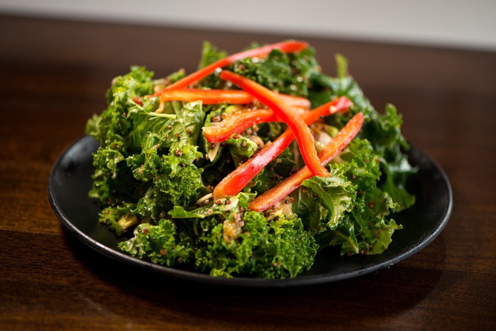  Italia Superfood Salad with baby kale, red quinoa, red peppers, raisins, almonds, avocado, and homemade lemon honey vinaigrette. Photo credit- Mia Yakel.