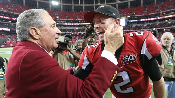 Falcons owner Arthur Blank and quarterback Matt Ryan celebrate a victory at the Georgia Dome. (Curtis Compton/ccompton@ajc.com)