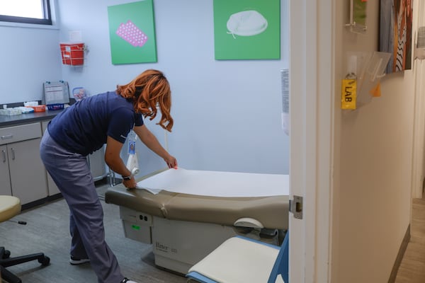 Medical assistant May Rodriguez preps an exam room for the next patient at Planned Parenthood in Jacksonville, Florida. After Roe v. Wade was overturned, many women in Georgia and other Southern states traveled to Florida to get abortions until it strengthened its own restrictions. Natrice Miller/AJC file