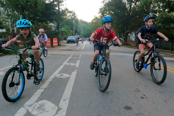 Participants in the weekly Parkside Elementary School “bike bus” head towards the school Friday, Sept. 20, 2024, in Atlanta. Ben Gray for the Atlanta Journal-Constitution