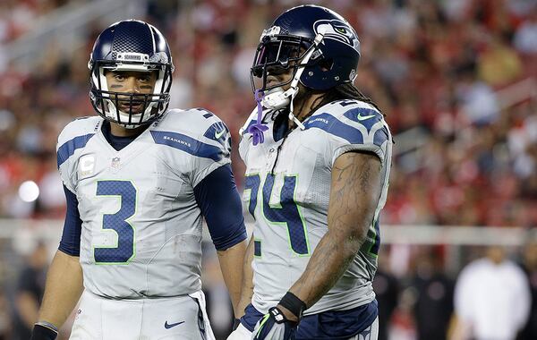 Seattle Seahawks quarterback Russell Wilson (3) and running back Marshawn Lynch face Cowboys next. (Marcio Jose Sanchez/AP)