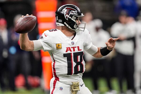 Atlanta Falcons quarterback Kirk Cousins (18) works in the pocket against the New Orleans Saints during the first half of an NFL football game, Sunday, Nov. 10, 2024, in New Orleans. (AP Photo/Gerald Herbert)