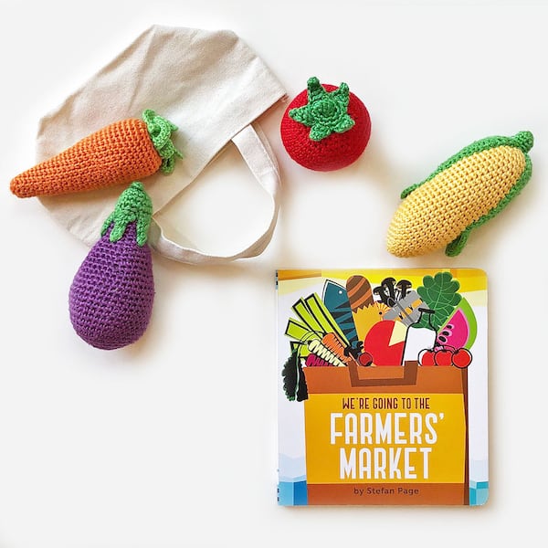 Food-curions toddlers will love an organic crochet vegetable rattle and board book about visiting the farmer's market.
Courtesy of Seed Factory