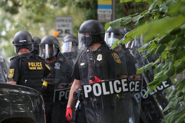 8/15/20 - Stone Mountain, GA - Police prepare to move in as several far-right groups, including militias and white supremacists, rally Saturday in the town of Stone Mountain, and a broad coalition of leftist anti-racist groups organized a counter-demonstration there after local authorities closed Stone Mountain park.   Alyssa Pointer / alyssa.pointer@ajc.com