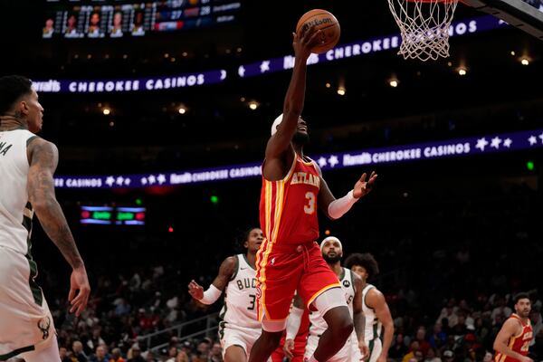 Atlanta Hawks guard Caris LeVert (3) shoots in the first half of an NBA basketball game against the Milwaukee Bucks, Tuesday, March 4, 2025, in Atlanta. (AP Photo/Brynn Anderson)