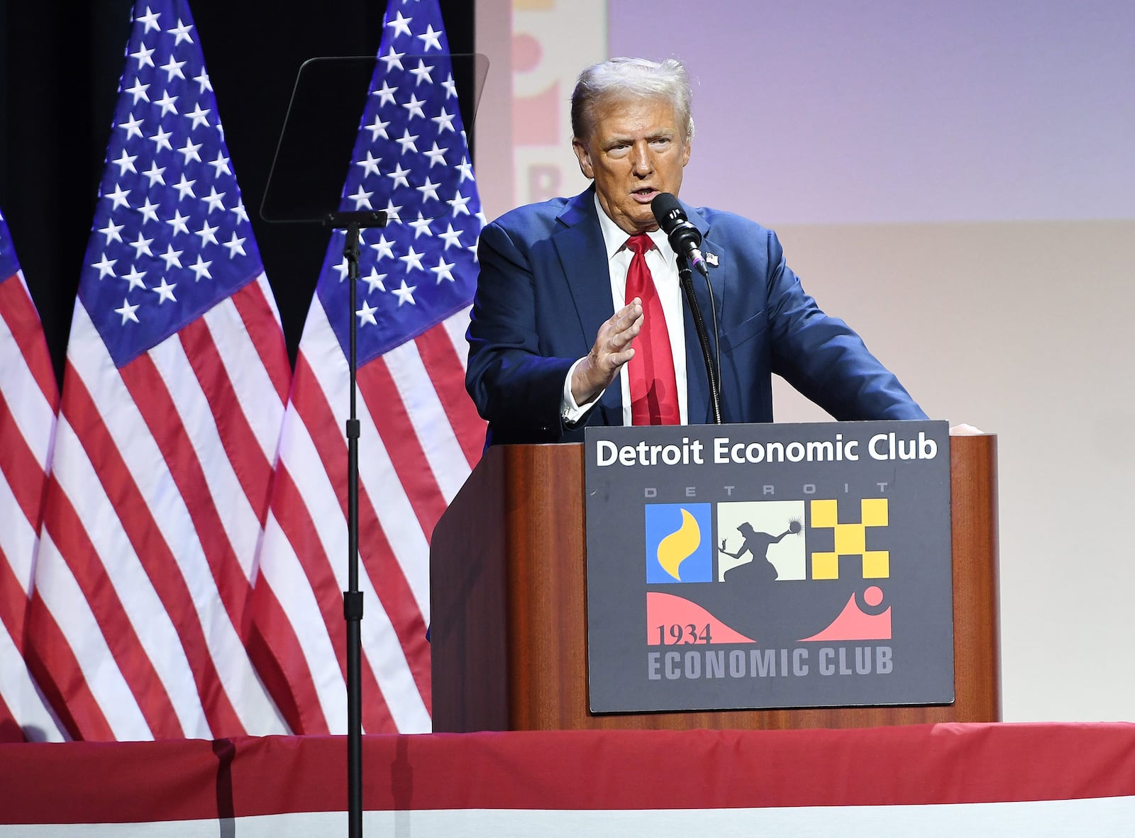 Republican presidential candidate Donald Trump touts a plan to revive the U.S. auto industry through aggressive tariffs on foreign imports, corporate tax cuts and a new tax write off for interest payments on car loans during a speech Thursday, Oct. 10, 2024, before the Detroit Economic Club. (Clarence Tabb Jr./The Detroit News/TNS)