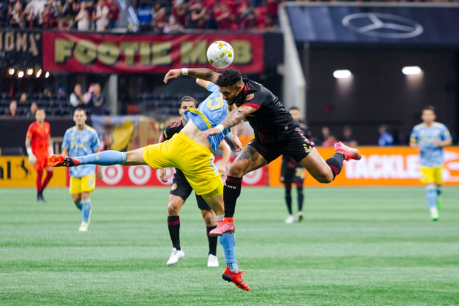 Dom Dwyer (right), forward for Atlanta United, and Philadelphia Union defender Jack Elliott (left) go for a header. CHRISTINA MATACOTTA FOR THE ATLANTA JOURNAL-CONSTITUTION.