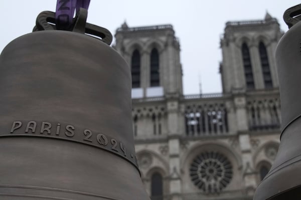 The bell that Olympic medalists rang at the Paris Games, left, and another bell are seen before their installation in Notre-Dame cathedral, ahead of the monument's grandiose reopening following a massive fire and five-year reconstruction effort, Thursday, Nov. 7, 2024 in Paris. (AP Photo/Christophe Ena)