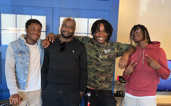 Nasier Fitzgerald, second from right, with his brothers, Samari Bolds, left, Sincere Bolds, right and his step-father Samori Bolds, second from right, two days before he was shot and killed on March 21. Fitzgerald was the oldest of seven siblings.