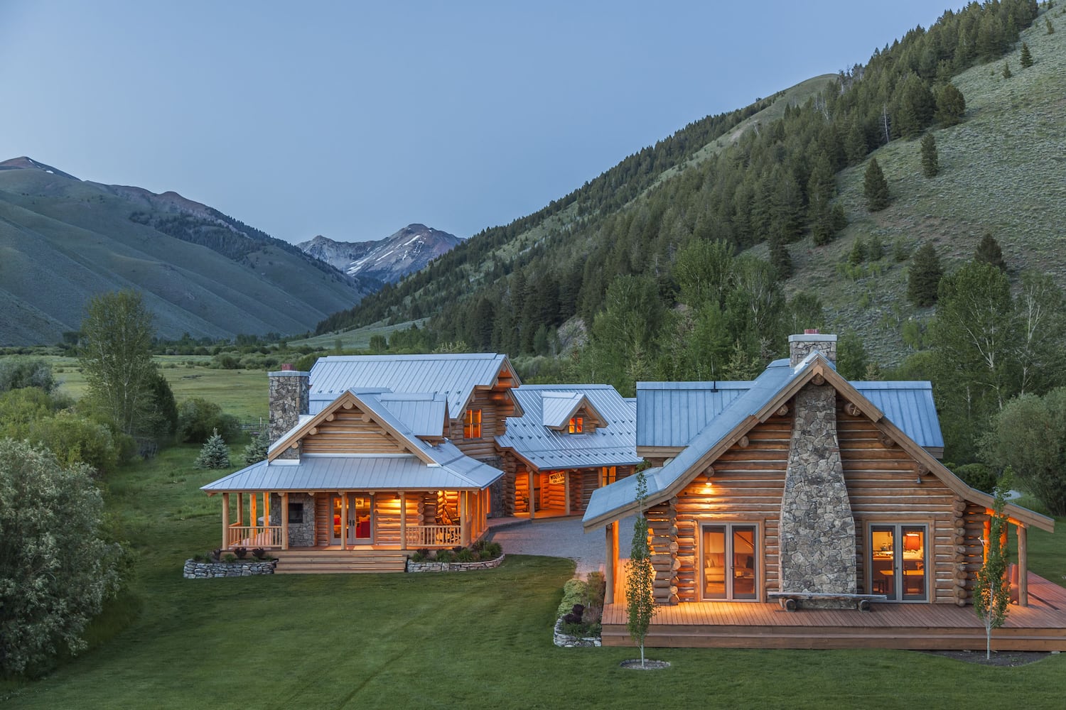 500-acre property has log cabins, mountain views