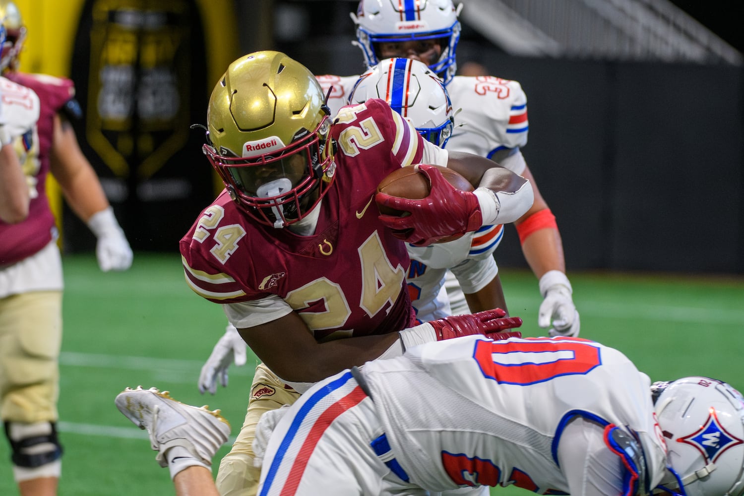 Brayden Tyson, running back for Brookwood, plows through Walton’s defense. (Jamie Spaar for the Atlanta Journal Constitution)