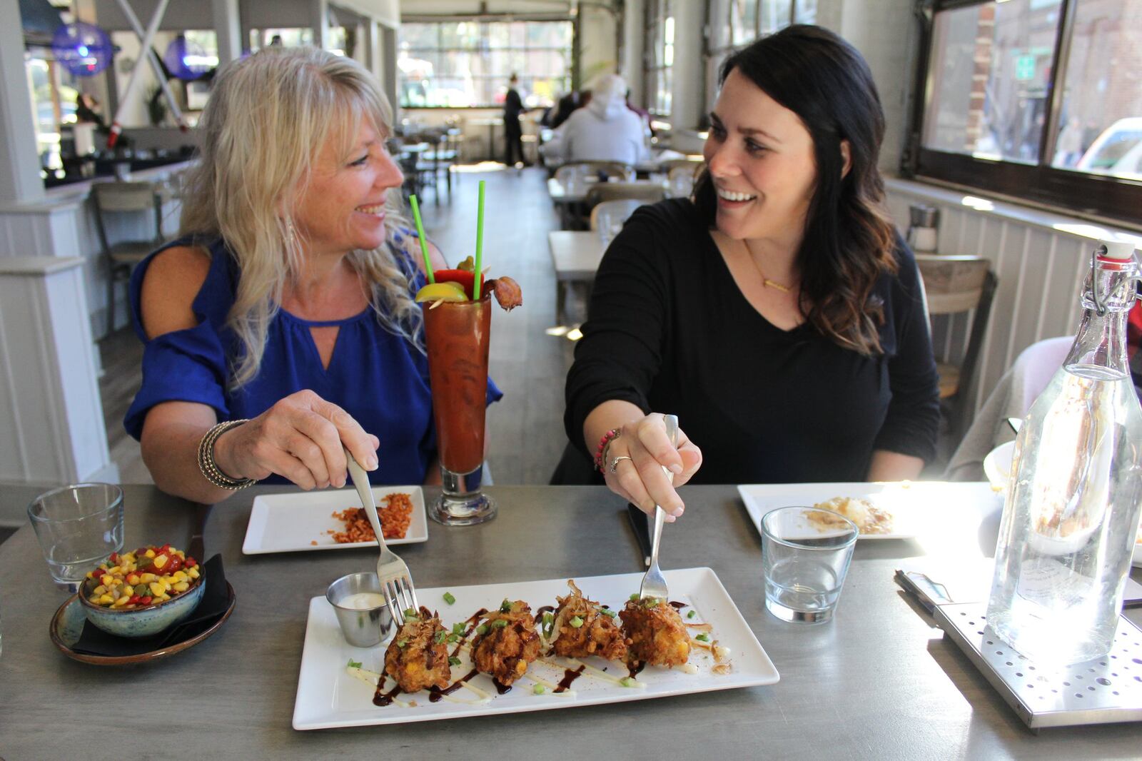 The Secret Food Tour of Charleston, S.C., features four to five stops at restaurants to dine on fried green tomatoes, she-crab soup and grits. Contributed