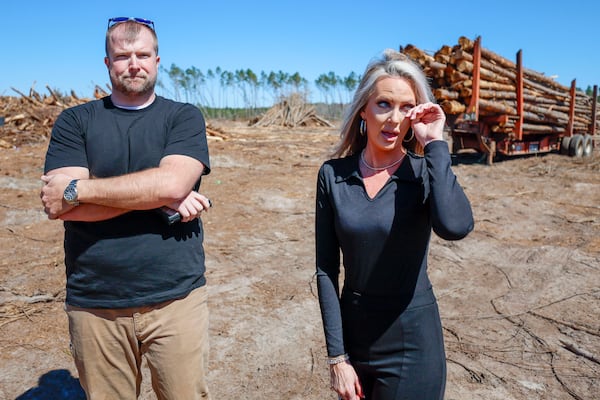 Lana and Jake Hilderbrand assess the damage to their timber farm. Lana’s father died recently, and the couple inherited his timberland in Jeff Davis County. Now, they are grappling with trying to salvage the damaged trees. (Miguel Martinez/ AJC)