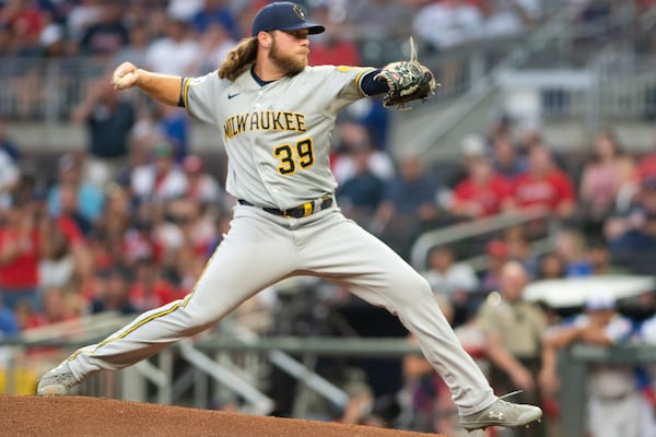  Brewers starting pitcher Corbin Burnes throws to a Braves batter during the first inning of a July 30 game at Truist Park. (AP Photo/Hakim Wright Sr.)