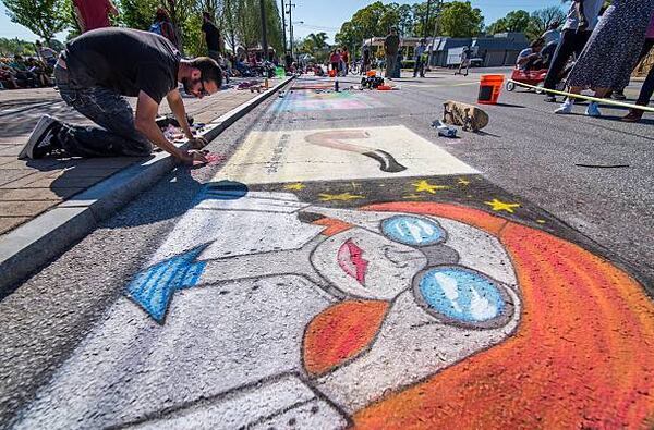 A chalk artist at one of the Atlanta Streets Alive events in 2016